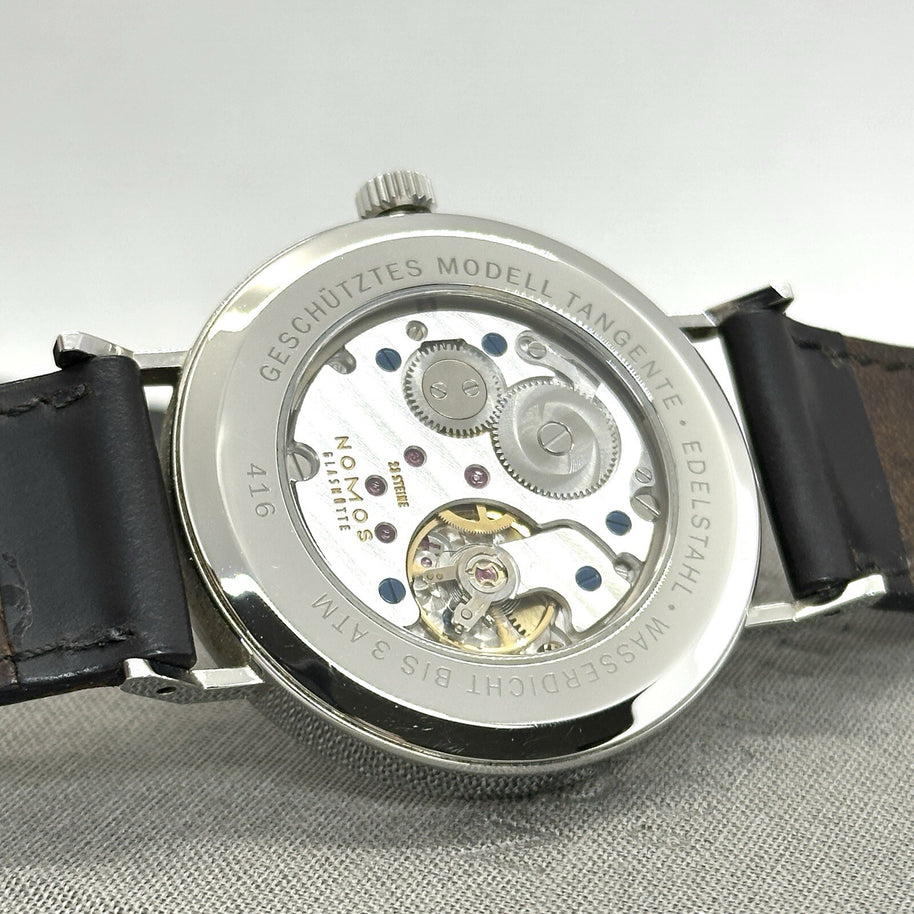 Nomos Glashütte Tangente 38 großes Modell Datum Handaufzug Glasboden Ref. 130