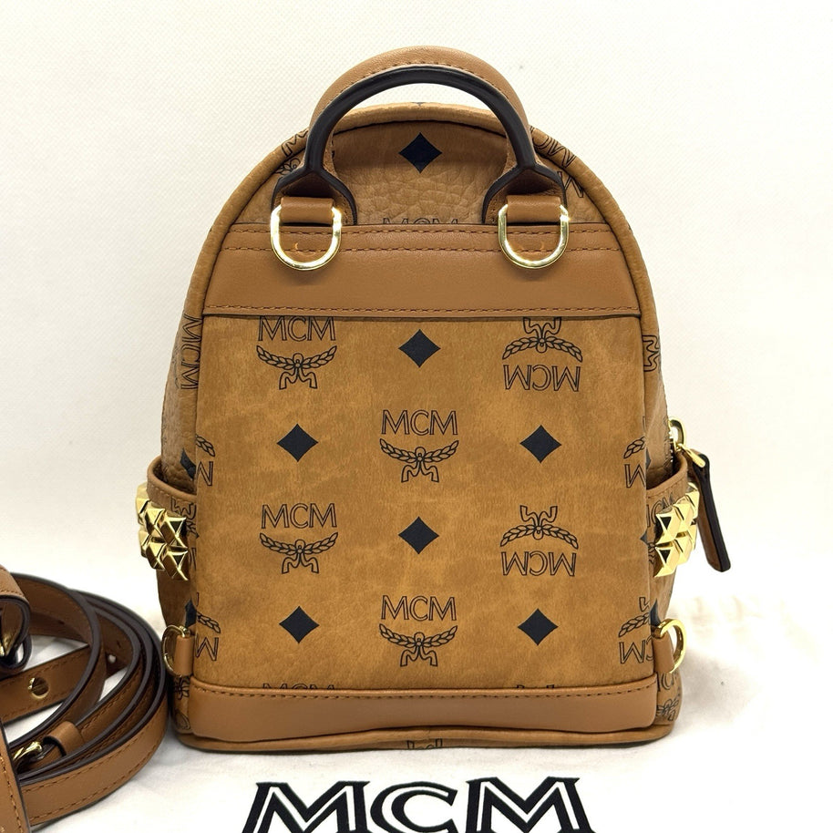 MCM Stark Rucksack Mini Backpack Bebe Boo Cognac mit seitlichen Nieten