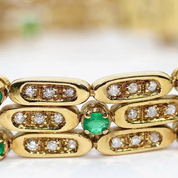 Damen Armband aus 18 Karat Gelbgold mit Diamanten und Smaragden