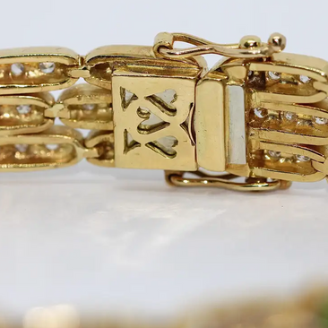 Damen Armband aus 18 Karat Gelbgold mit Diamanten und Smaragden