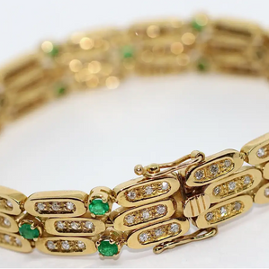 Damen Armband aus 18 Karat Gelbgold mit Diamanten und Smaragden