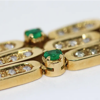 Damen Armband aus 18 Karat Gelbgold mit Diamanten und Smaragden