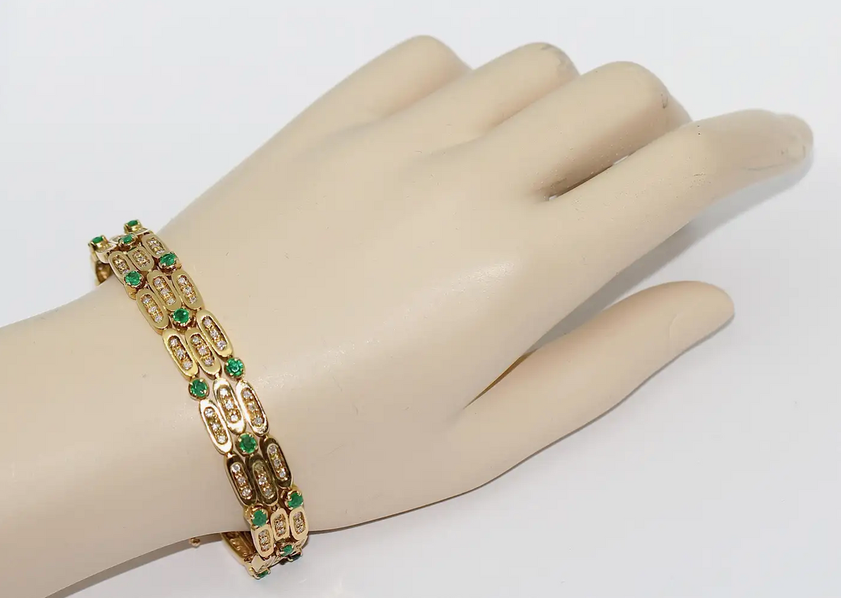 Damen Armband aus 18 Karat Gelbgold mit Diamanten und Smaragden