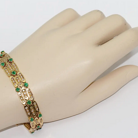 Damen Armband aus 18 Karat Gelbgold mit Diamanten und Smaragden