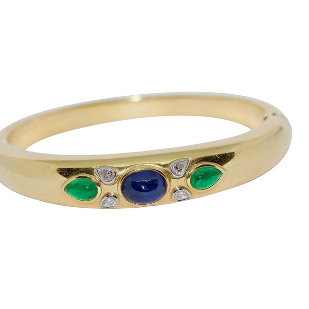 Armreif aus 18 Karat Gelbgold mit Diamanten, Saphir und Smaragden