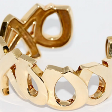 Tiffany & Co. Paloma Picasso Armreif „Love & Kisses XO“ aus 18 Karat Gelbgold