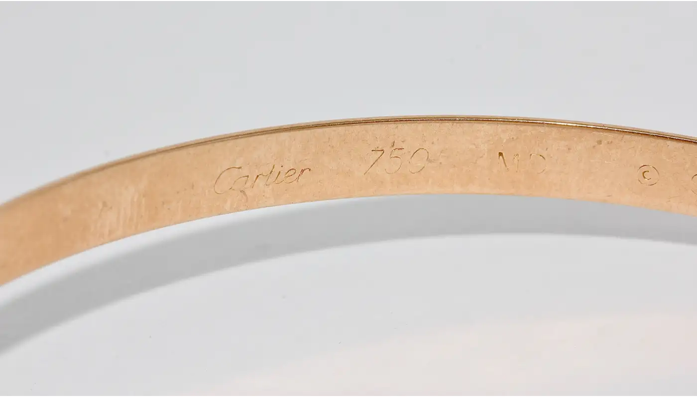 Cartier „Trinity“ Armreif MD aus 18 Karat Gelb-, Weiß- und Roségold