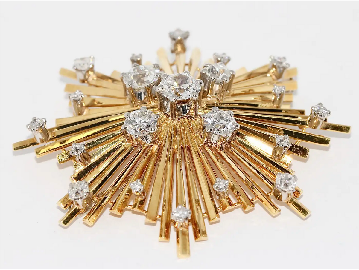 Brosche „Sternexplosion“ in 18 Karat Gelbgold mit Diamanten