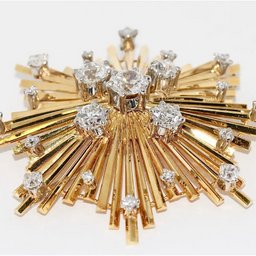 Brosche „Sternexplosion“ in 18 Karat Gelbgold mit Diamanten