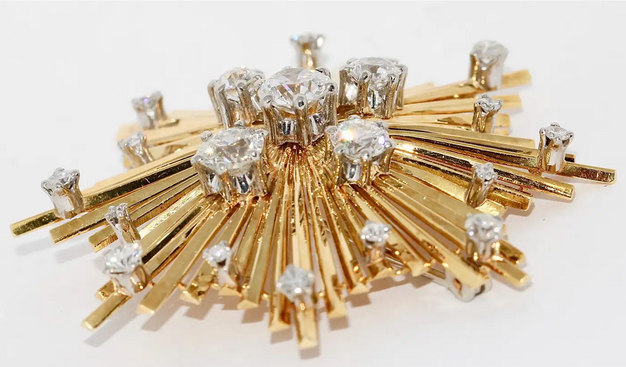 Brosche „Sternexplosion“ in 18 Karat Gelbgold mit Diamanten
