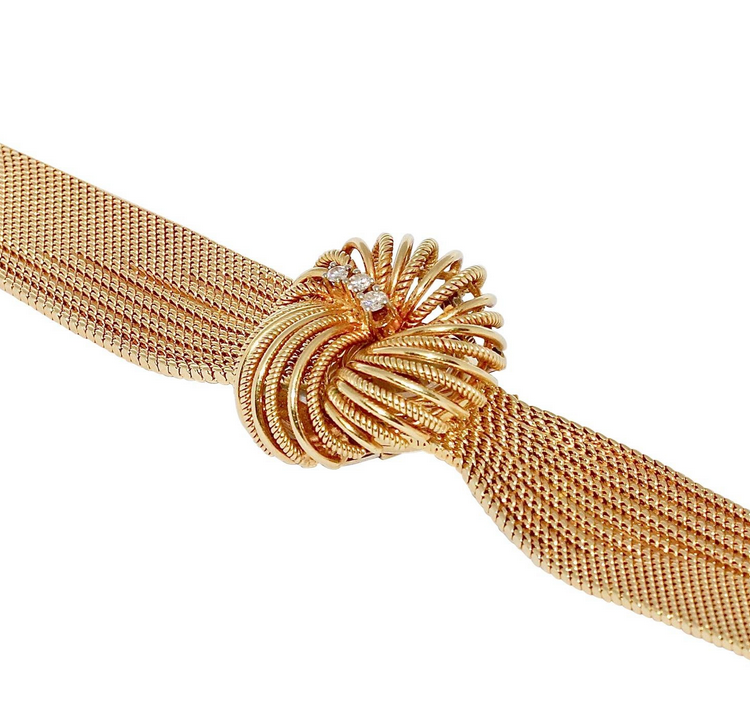 Universal Genève Damenarmbanduhr aus 18 Karat Gold mit Diamanten – multifunktional als Uhr & Brosche