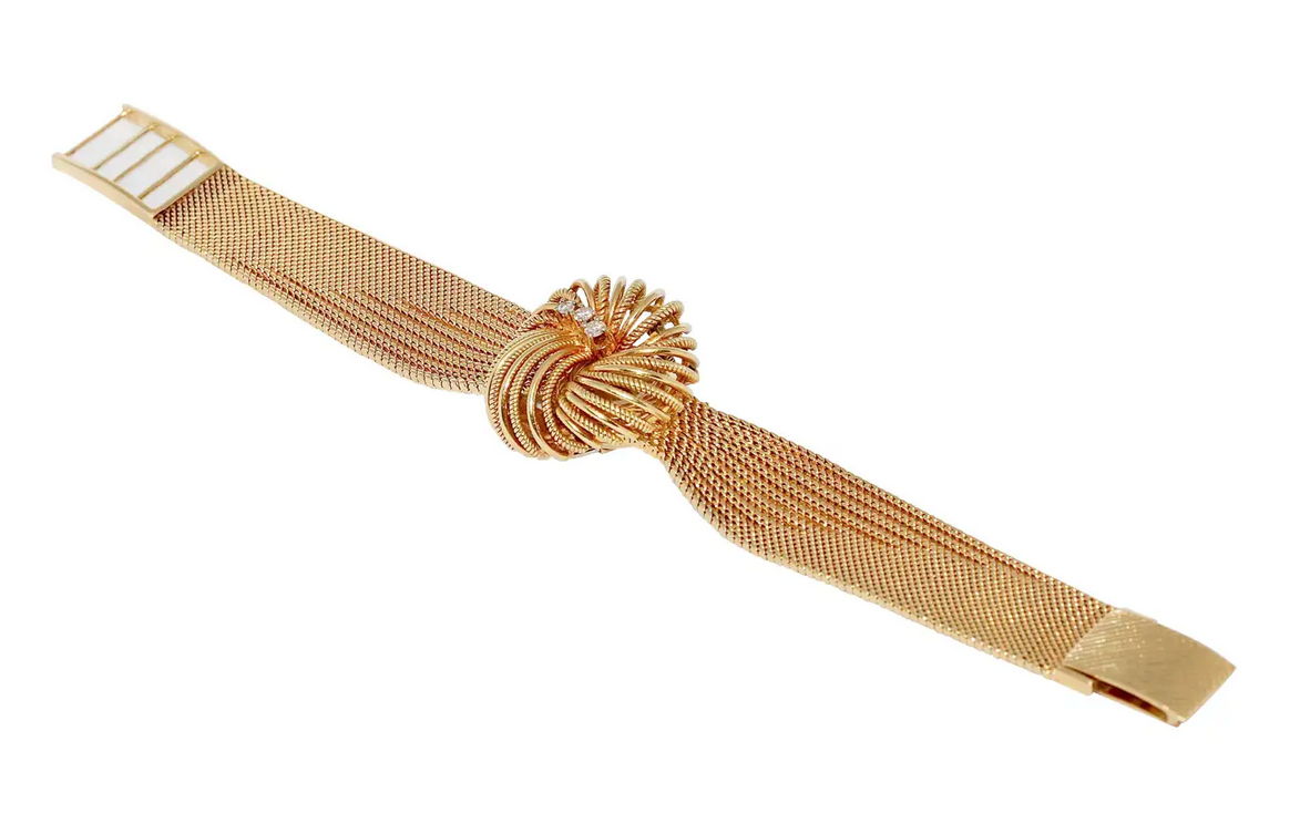 Universal Genève Damenarmbanduhr aus 18 Karat Gold mit Diamanten – multifunktional als Uhr & Brosche