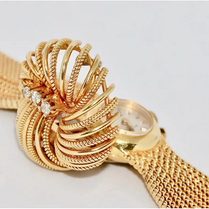 Universal Genève Damenarmbanduhr aus 18 Karat Gold mit Diamanten – multifunktional als Uhr & Brosche