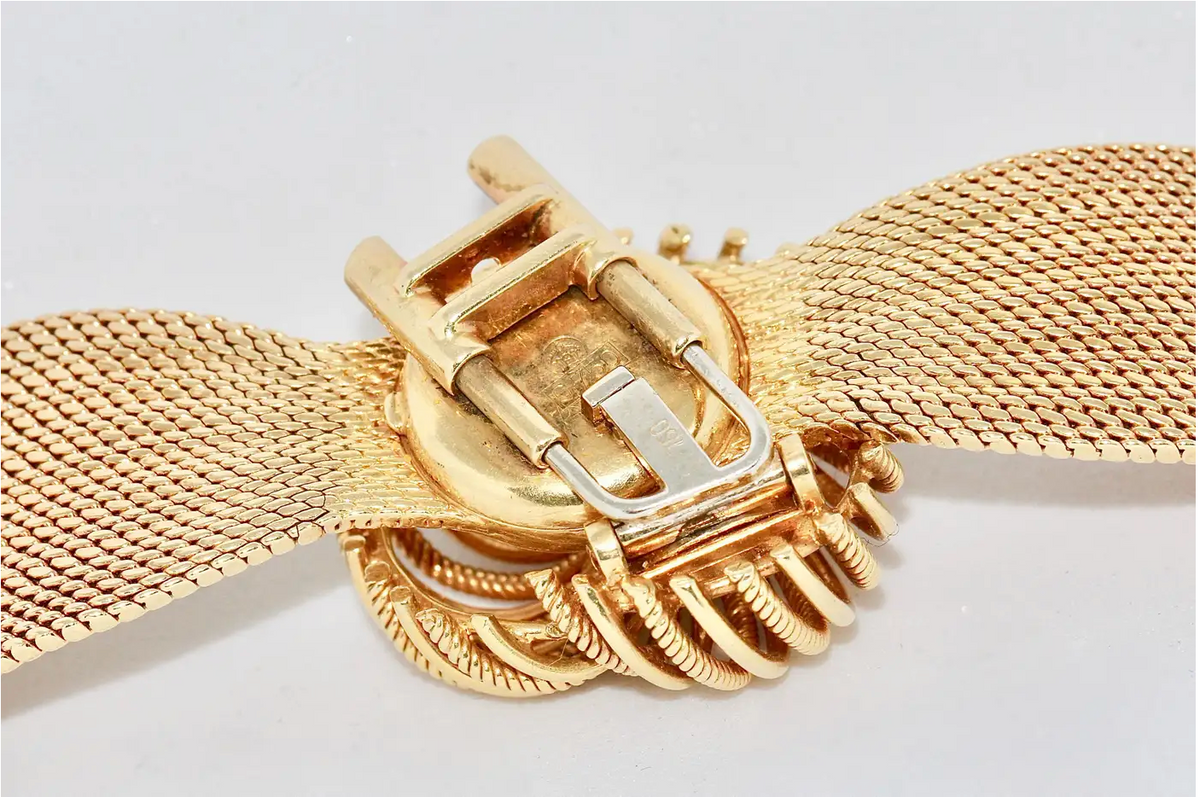 Universal Genève Damenarmbanduhr aus 18 Karat Gold mit Diamanten – multifunktional als Uhr & Brosche