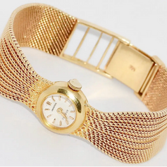 Universal Genève Damenarmbanduhr aus 18 Karat Gold mit Diamanten – multifunktional als Uhr & Brosche