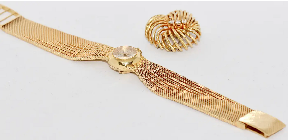Universal Genève Damenarmbanduhr aus 18 Karat Gold mit Diamanten – multifunktional als Uhr & Brosche