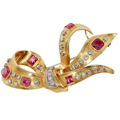 Elegante Brosche aus 18 Karat Gold mit Rubinen und Diamanten