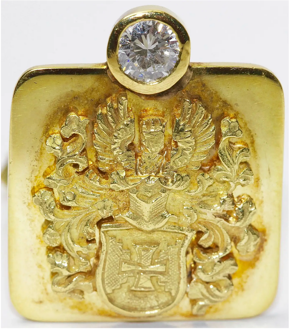 Prunkvolle Manschettenknöpfe aus 18 Karat Gelbgold mit Brillanten und Wappenmotiv